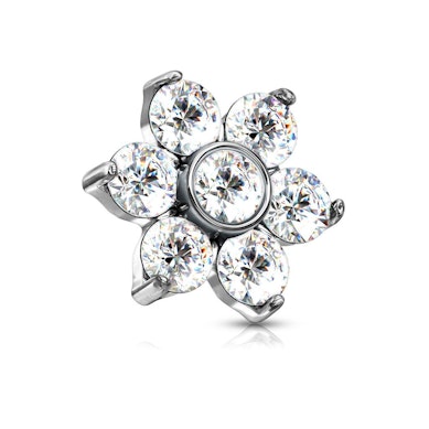 Dermal anchor met een bloem gevormd uit steentjes