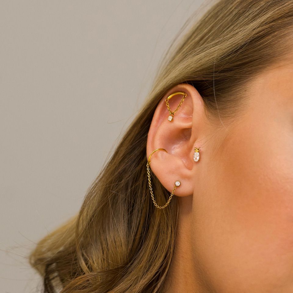 Labret met gebogen staafje, kettinkje en hangertje