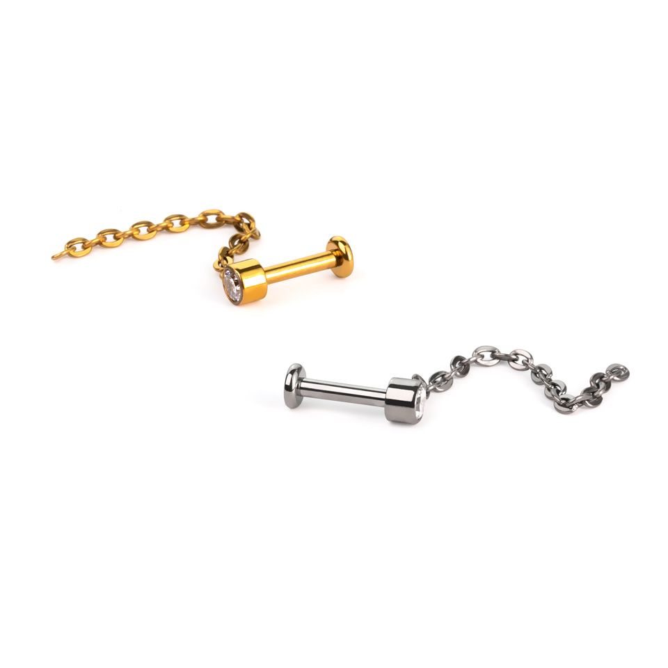Sierlijke titanium labret met steentje en hangertje