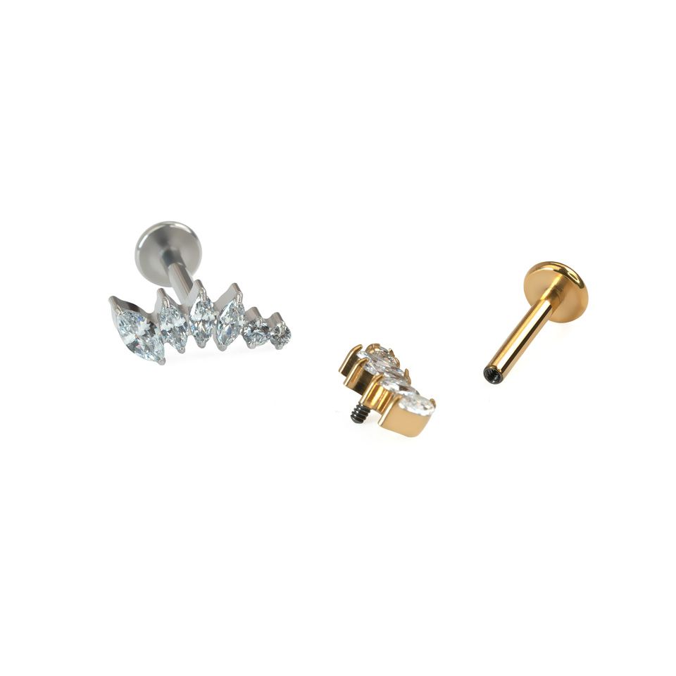 Gebogen titanium labret met steentjes in afnemende groottes