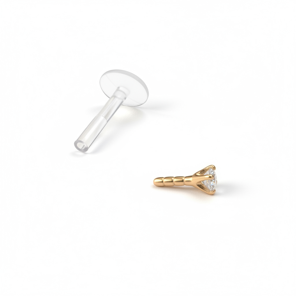 Labret van 14 karaats goud met een ronde steen en ptfe staaf