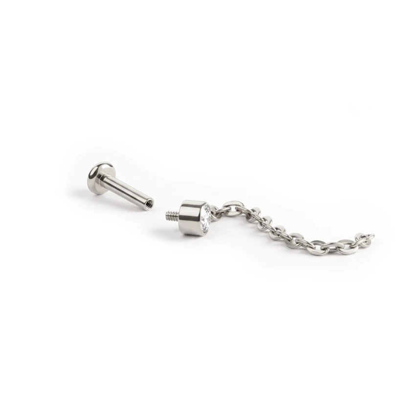 Sierlijke titanium labret met steentje en hangertje