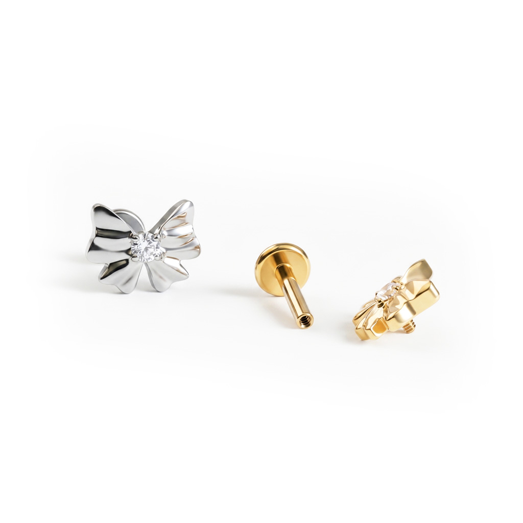 Labret van titanium met strikje en centrale steen