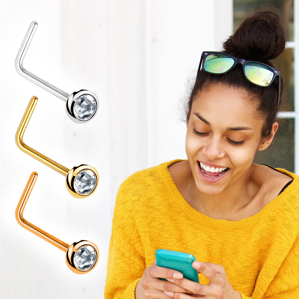 Neuspiercing uit 14 karaats goud met ingezette steen