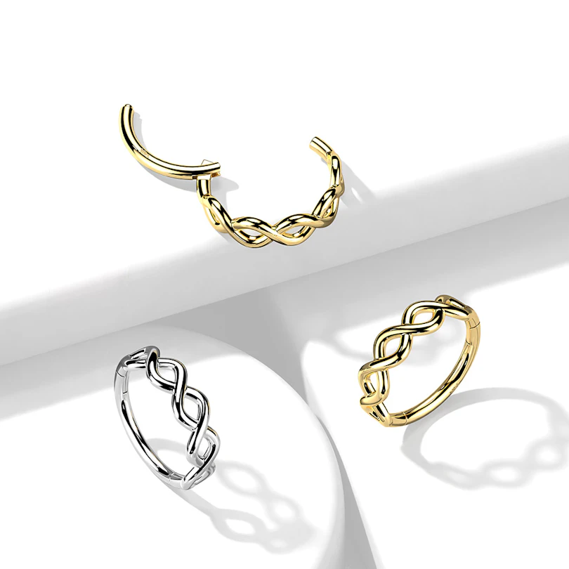 Ring van 14 karaats goud met een scharnier en een infinity twist